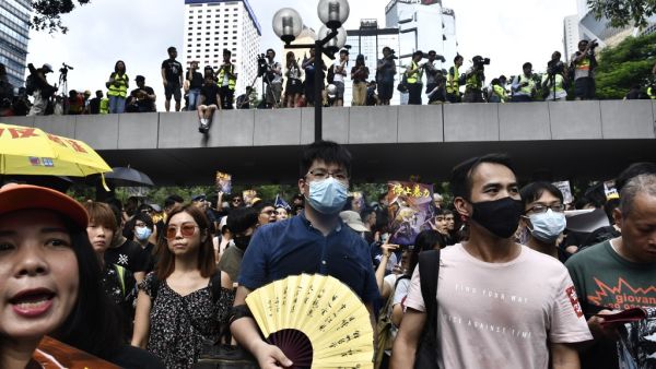 Protesters march during a demonstration in Hong Kong (AFP)