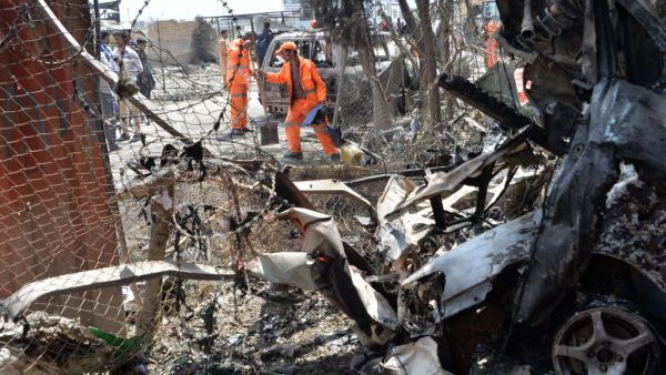 Afghan municipality workers work to clear up the site of an attack in Kabul on July 29, 2019, a day after a deadly assault targeting a political campaign office. (AFP/ File Photo)