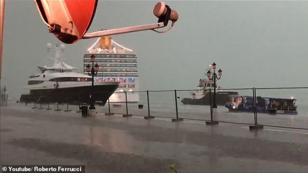 An Italian cruise ship had just seconds to swerve dry land in a Venice dock after its captain appeared to lose control of the vessel during a heavy storm. (YouTube)