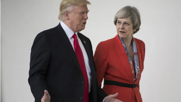 US President Donald Trump and British Prime Minister Theresa May walk at the White House on January 27, 2017 in Washington, DC. (Brendan Smialowski, AFP)
