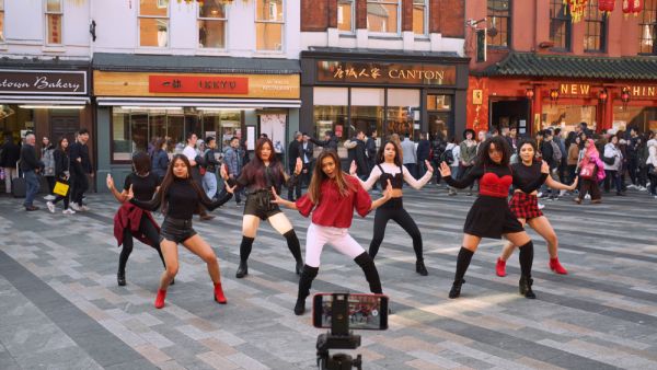 A K-Pop band films a video in Chinatown, London. (Shutterstock/ File Photo)