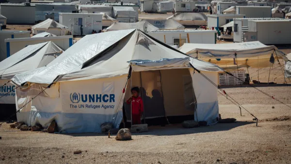 Syrian child standing outside her tent at the Zaatari Refugee camp in Mafraq, jordan. (Shutterstock/ File Photo)