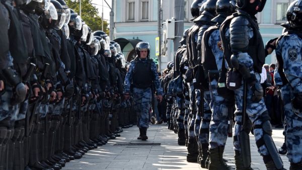 Servicemen of the Russian National Guard are seen during an unsanctioned rally urging fair elections in downtown Moscow  (AFP)