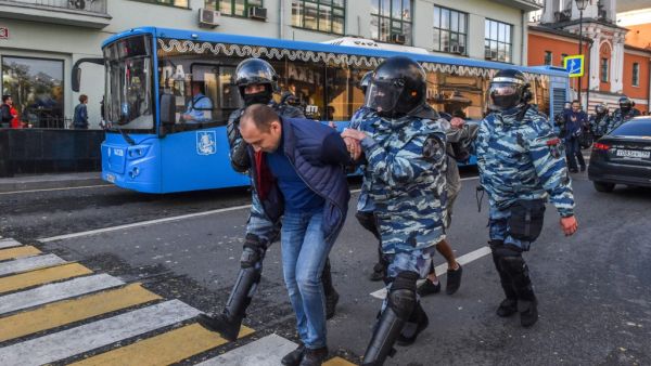 Servicemen of the Russian special police forces detain a man after a rally urging fair elections in central Moscow on August 10, 2019.  (AFP/ File Photo)