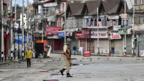 A security personnel patrols on a deserted road of the Lal Chowk area in Srinagar on August 19, 2019. (AFP/ File Photo)
