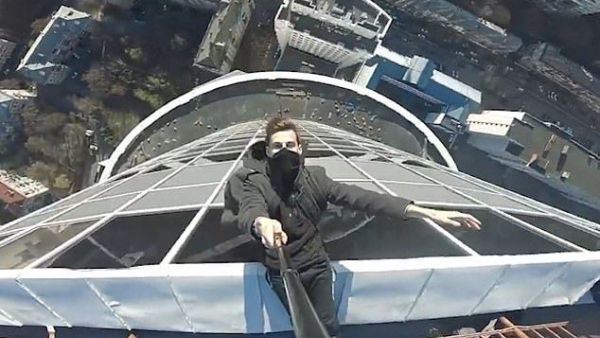 Adventurer shiey uses a camera attached to a selfie stick to show the daring trick off to his fans on social media (https://www.dailymail.co.uk)