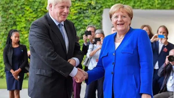 Boris Johnson was greeted by Angela Merkel in Berlin this afternoon as he arrived in Germany for showdown Brexit talks (AFP/ File Photo)