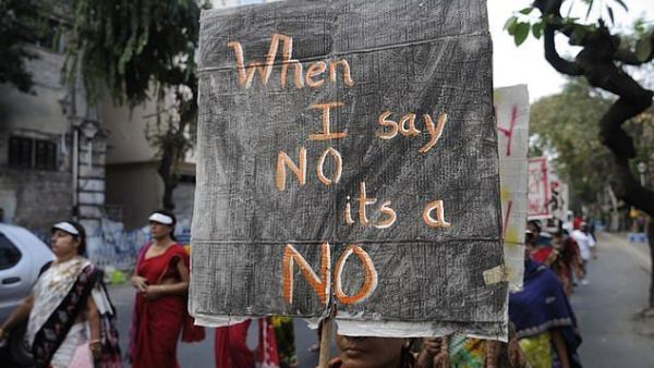 This picture shows a woman holding a banner which reads 'no means no' during a rally to remember a woman gang-raped in New Delhi (Shutterstock)	