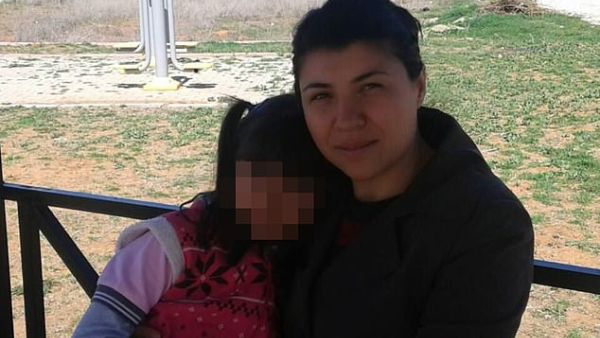 Emine Badegül Bulut pictured with her daughter. She was knifed to death by her ex-husband in a cafe in Kirikkale, Turkey on Sunday . (Daily Mail)