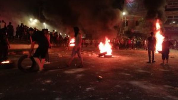Protesters in Ramtha during small-scale riots that broke out on Friday that saw young people closing the main street in their northern district in protest against the government's decision to intensify measures on the Jaber border crossing with Syria. (Twitter)