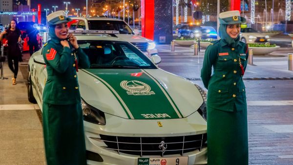 Dubai women police at the luxurious Ferrari near Dubai Mall. (Shutterstock/ File Photo)