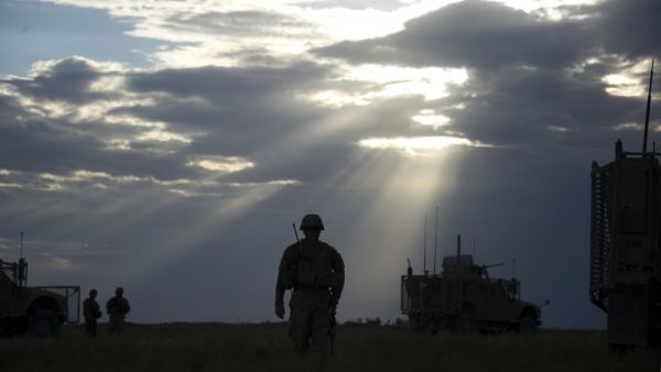 US Sergeant Andrew Warnerwalks to a Mine Resistant Ambush Protected (MRAP) vehicle in the village of Hasti in the province of Paktikain Afghanistan. (AFP/ File Photo)