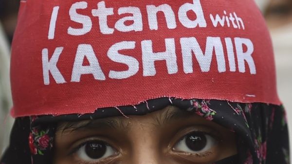 An activist of Jamaat-e-Islami Pakistan takes part of a protest rally against the Indian decision to strip the disputed Kashmir region of its special autonomy, in Karachi  (AFP)