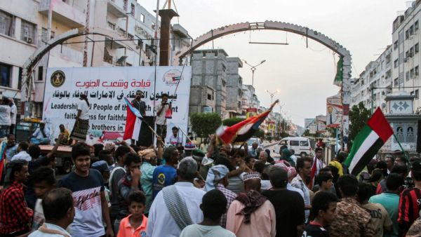 People fly the flags of the UAE (R) and south Yemen (L) as Yemenis from the country's south gather ahead of a demonstration in support of the UAE called for by the Southern Transitional Council (STC) which seeks independence for south Yemen, at al-Maala square in the centre of the second city of Aden on September 4, 2019. (AFP/ File Photo)