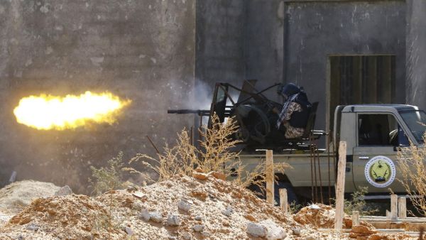 A fighter loyal to the internationally recognised Libyan Government of National Accord (GNA)fires a truck-mounted gun during clashes with forces loyal to strongman Khalifa Haftar in the capital Tripoli's suburb of Ain Zara, on September 7, 2019. (Mahmud TURKIA / AFP)