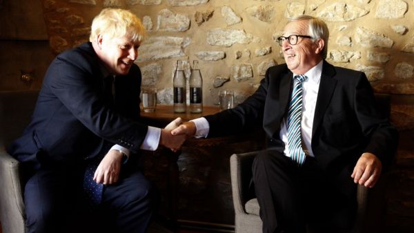 EU Commission president Jean-Claude Juncker (R) shakes hands with British Prime Minister Boris Johnson (L) prior to their meeting, on September 16, 2019 in Luxembourg. (AFP/ File Photo)