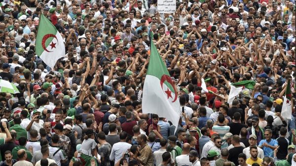 Algerian protesters take part in a demonstration against the country's army chief in Algeria's capital Algiers on September 20, 2019, as the police toughens its line ahead of December elections. (RYAD KRAMDI / AFP)