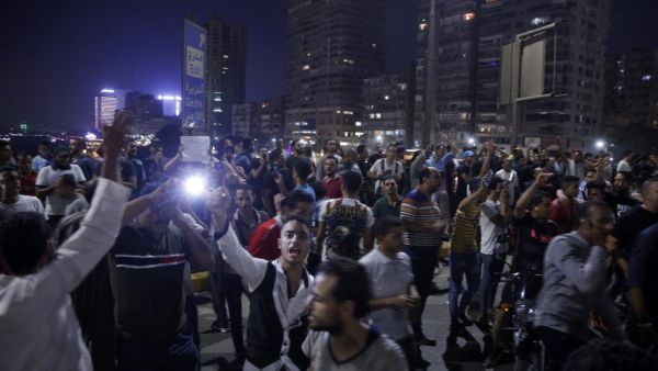 Egyptian protesters shout slogans as they take part in a protest calling for the removal of President Abdel Fattah al-Sisi in Cairo's downtown on September 20, 2019. (AFP)