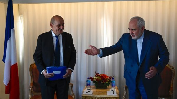 French Minister of Foreign Affairs Jean-Yves Le Drian (L) and Mohammad Zarif, Foreign Minister of Iran look on before their meeting on September 22, 2019 in New York City. (Johannes EISELE / AFP)