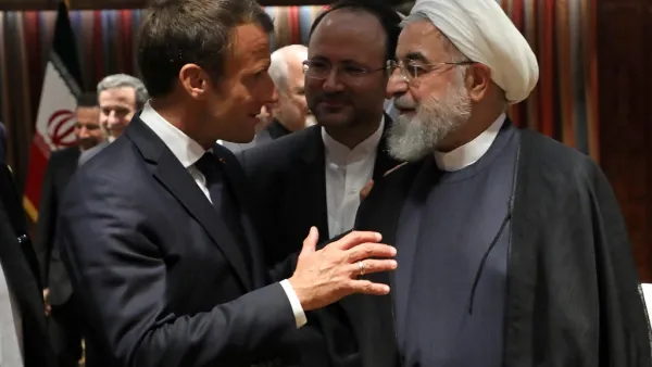 French President Emmanuel Macron (L) and Iranian President Hassan Rouhani speak at the United Nations headquarters on September 23, 2019, in New York. LUDOVIC MARIN / AFP
