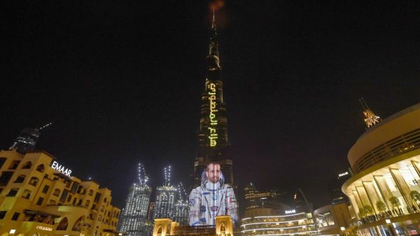 A picture taken on September 25, 2019, shows the Gulf emirate's Burj Khalifa, the world's tallest skyscraper, lit with an image of 35-year-old Emirati astronaut Hazzaa al-Mansoori, who is set to spend eight days aboard the International Space Station (ISS). (AFP/ File Photo)