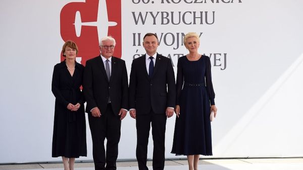 Polish President Andrzej Duda (centre right) with his wife Agata Kornhauser-Duda standing alongside German President Frank-Walter Steinmeier (centre left) and his wife Elke Buedenbender before commemorative ceremonies in Warsaw (AFP)