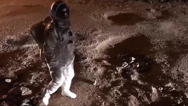 The man takes slow steps as he pretends to be on the moon which has gravity of around 17% compared to that on Earth  (Facebook)