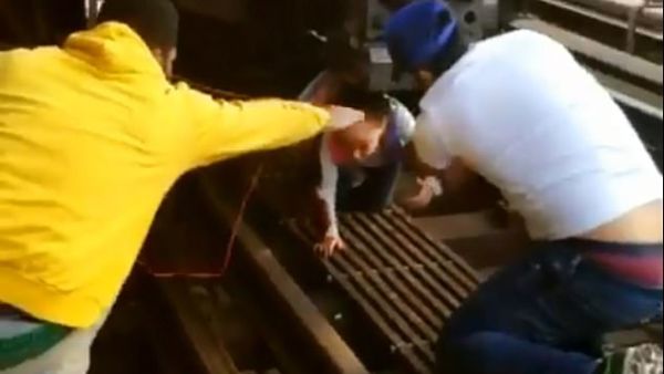Cesar Dominguez (right), 29, was one of those good Samaritans said he 'had to jump down' after he heard the young girl crying 'my dad, my dad'. (Instagram)