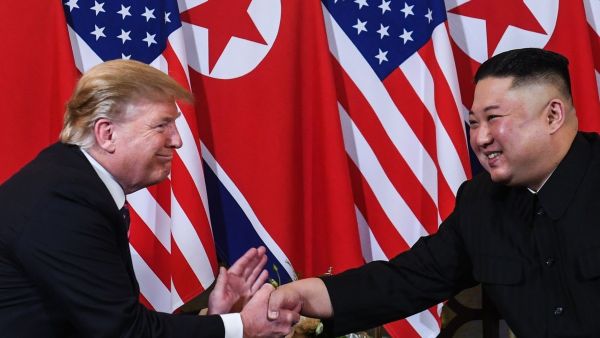 US President Donald Trump shakes hands with North Korean leader Kim Jong-un following a meeting in Hanoi, Vietnam, in February. (AFP)