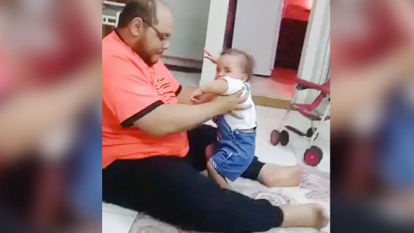 Palestinian resident of Saudi Arabia was filmed torturing the baby girl. (Video Screenshot)