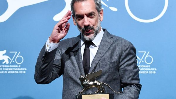 US director Todd Phillips holds the Golden Lion award for best film he won for Joker at the Venice International Film Festival this month. ( AFP)