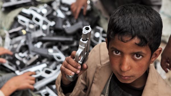 Children playing with toy guns on the street of Sanaa  (Shutterstock)	