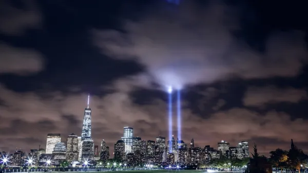 Illuminated Manhattan skyline with two beams of light in memory of 9/11 (Shutterstock)	