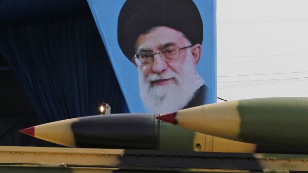 Iranian military truck carrying surface-to-air missiles past a portrait of Iran's Supreme Leader Ayatollah Ali Khamenei during a parade on the occasion of the country's annual army day. (AFP/ File Photo)