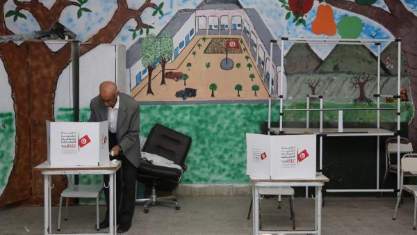 A Tunisian man casts his ballot at a polling station in the capital Tunis on October 6, 2019, during the third round of legislative elections since the North African country's 2011 revolution. (AFP/ File Photo)