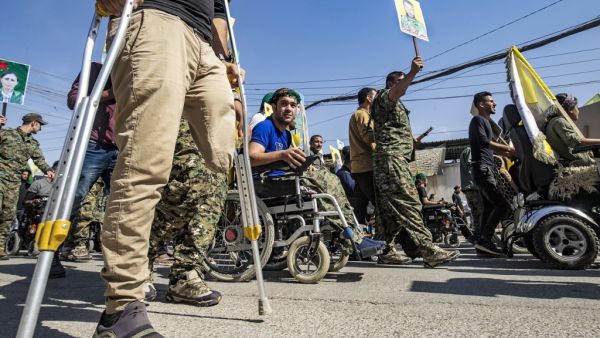 Fighters and veterans from the Kurdish women's protection units (YPJ) and the people's protection units (YPG) march in front of the UN headquarters in the northern Kurdish Syrian city of Qamishli during a protest against Turkish threats in the Kurdish region, on October 8, 2019. (AFP/ File Photo)