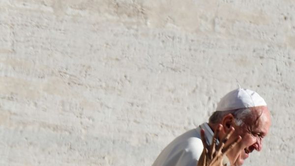 A worshipers reaches out to Pope Francis as he arrives for the weekly general audience on October 9, 2019 at St. Peter's Square in the Vatican. Alberto PIZZOLI / AFP