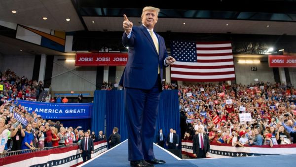 US President Donald Trump gestures as he arrives for a "Keep America Great" rally at Sudduth Coliseum at the Lake Charles Civic Center in Lake Charles, Louisiana, on October 11, 2019. (SAUL LOEB / AFP)
