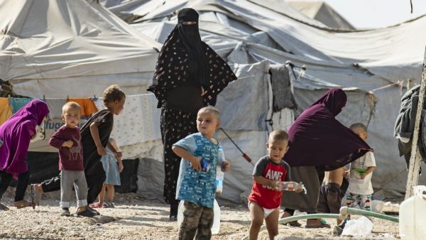 Women look after children at the Kurdish-run al-Hol camp for the displaced where families of Islamic State (IS) foreign fighters are held, in the al-Hasakeh governorate in northeastern Syria, on October 17, 2019. (Delil SOULEIMAN / AFP)