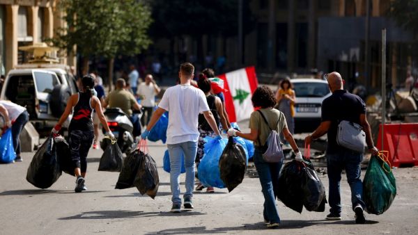 Lebanese activists clean a main road in downtown Beirut on October 19, 2019 as hundreds continued to gather in Lebanon for a third day of protests against tax increases and alleged official corruption after the security forces made dozens of arrests. (AFP/ File Photo)