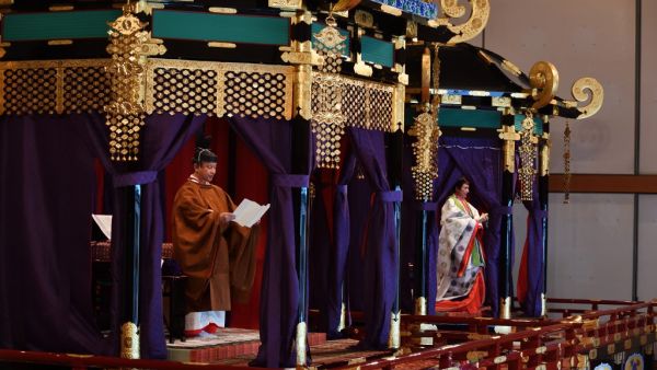 Emperor Naruhito (L) delivers his speech as Empress Masako (R), attends the enthronement ceremony where emperor officially proclaims his ascension to the Chrysanthemum Throne at the Imperial Palace in Tokyo on October 22, 2019. (Kazuhiro NOGI / POOL / AFP)