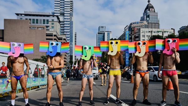 Participants pose with stylised rainbow elephant masks as they take part in the annual gay pride parade in Taipei on October 26, 2019. Thousands including members of the LGBT community on October 26 took part in the first gay pride parade held after Taiwan earlier this year legalised same-sex marriages, the culmination of a three-decade fight for equality. Sam YEH / AFP