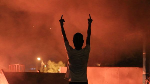 An Iraqi protester gestures with his fingers during an anti-government demonstration in the Shiite shrine city of Karbala, south of Iraq's capital Baghdad on October 27, 2019. Iraq's capital and the country's south have been rocked by a second wave of demonstrations since October 24, with protesters digging in despite tear gas, curfews and violence that has left more than 70 dead. AFP