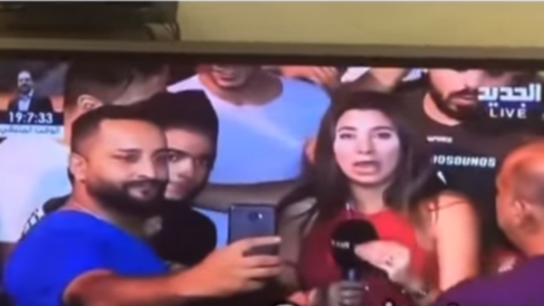 The man tried to take a selfie with the reporter after groping her. (YouTube)