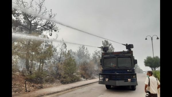 Riot control vehicles mounted with water cannons are employed to fight the fires in Chouf on Tuesday, Oct. 15, 2019. (The Daily Star/Mohammed Zaatari)