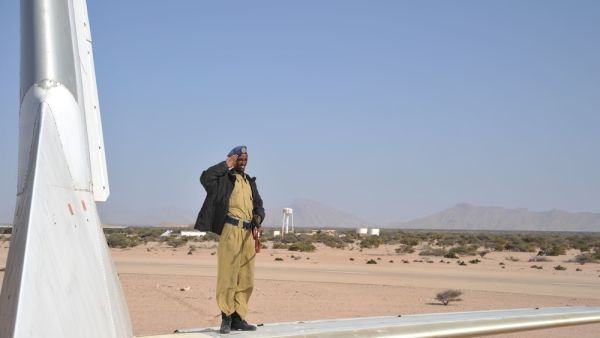 The police officer by crashed plane at the airport of Berbera. (Shutterstock/ File Photo)