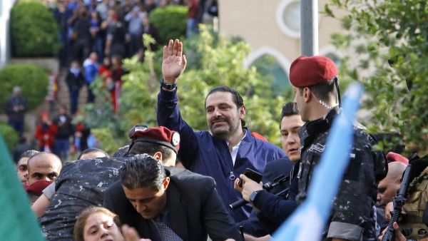 Lebanese prime minister Saad Hariri greets his supporters upon his arrival at his home in Beirut on November 22, 2017. (Marwan Tahtah / AFP)