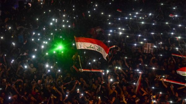 Iraqi protesters gather during a late anti-government demonstration in Nasiriyah, the capital of the southern province of Dhi Qar on November 4, 2019.  (AFP)