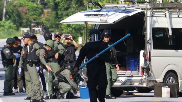 Members of a bomb squad inspect the site of an attack by suspected Muslim militants in Yala province on November 6, 2019. At least fifteen people were killed and another four injured in attacks by suspected Muslim militants in Thailand's violence-wracked south, an army spokesman said on November 6, the largest death toll in years. TUWAEDANIYA MERINGING / AFP
