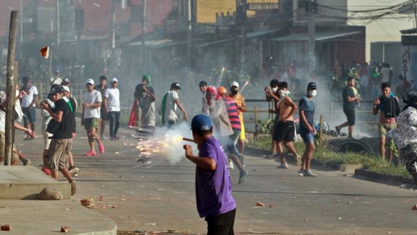 supporters of Bolivian opposition candidate Carlos Mesa and of President Evo Morales clash during a demonstration over disputed poll results, in Santa Cruz, Bolivia. Different countries in Latin America are currently being rocked by political change and upheaval. (DANIEL WALKER / AFP)